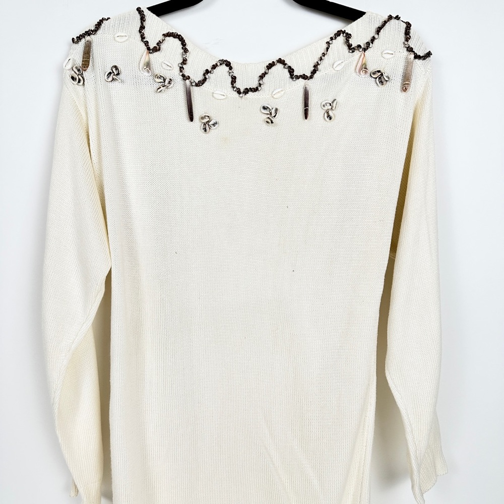 White long sleeve sweater with real sea shells.